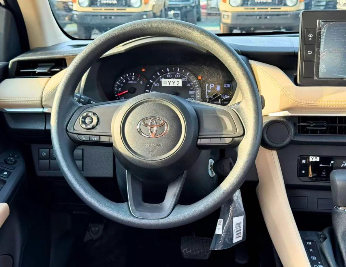 Toyota Yaris E  STANDRAD OPTION || 1.5L PETROL V4 | FABRIC SEATS | DVD | REAR PARKING SENSOR (CODE # YREO)-13-0
