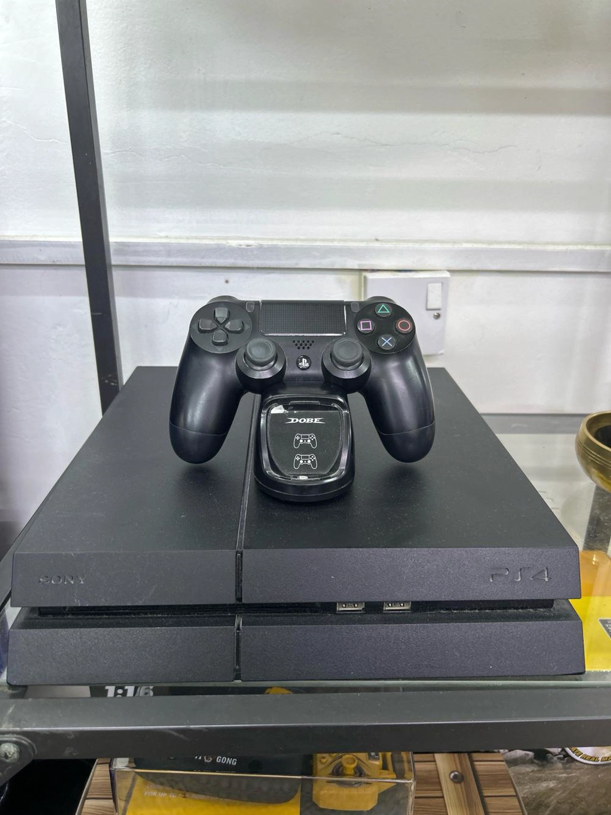 Sony PlayStation 4 Console with DualShock 4 Controller and Dobe Charging Dock