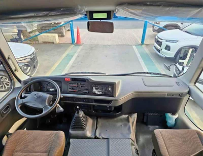 Toyota Coaster 2.7L PETROL M/T DUAL TONE || 23 SEATER | AUTO DOOR | HLF LUGGAGE RACK (CODE # COPB)-10