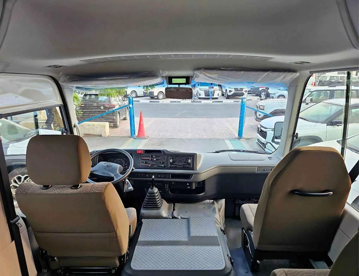 Toyota Coaster 2.7L PETROL M/T DUAL TONE || 23 SEATER | AUTO DOOR | HLF LUGGAGE RACK (CODE # COPB)-9-0