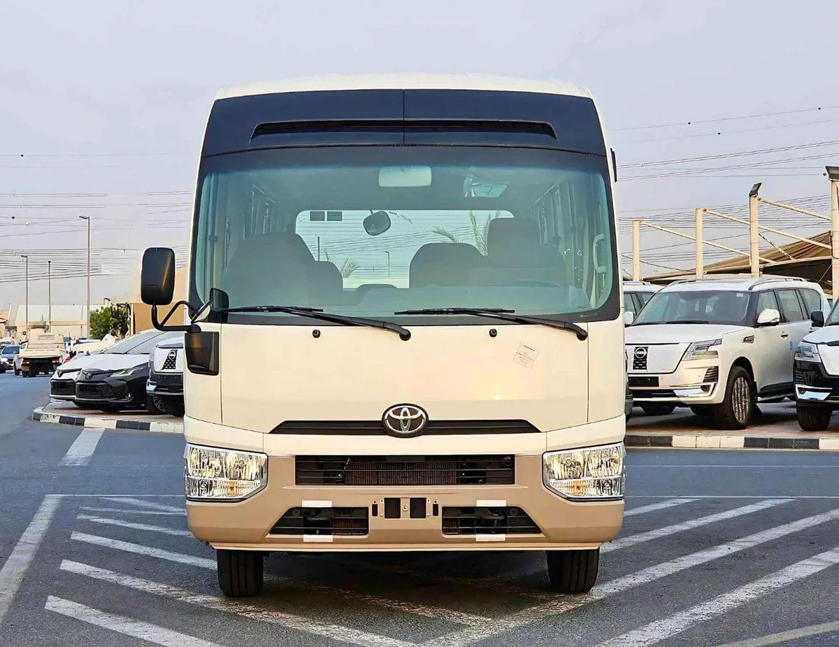 Toyota Coaster 2.7L PETROL M/T DUAL TONE || 23 SEATER | AUTO DOOR | HLF LUGGAGE RACK (CODE # COPB)