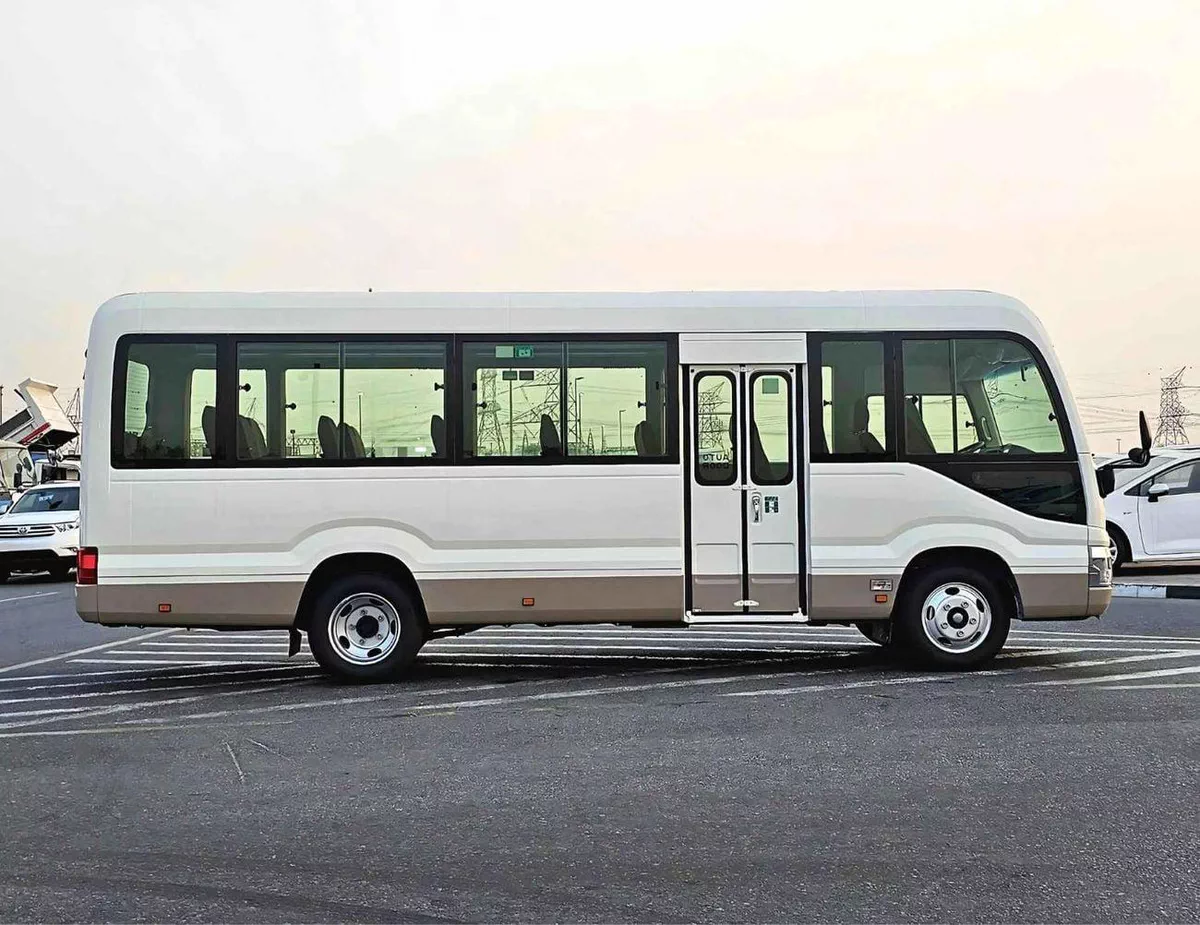 Toyota Coaster 2.7L PETROL M/T DUAL TONE || 23 SEATER | AUTO DOOR | HLF LUGGAGE RACK (CODE # COPB)-1-0