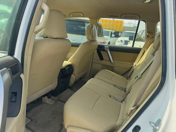 Toyota Prado 2014 white cooor GCc Caleb car