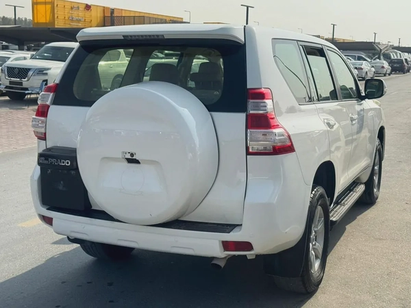 Toyota Prado 2014 white cooor GCc Caleb car