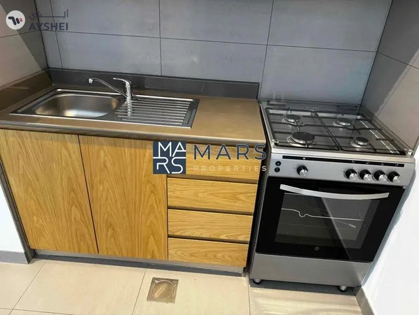 Spacious studio with kitchen appliances and all facilities available in Al mamsha.