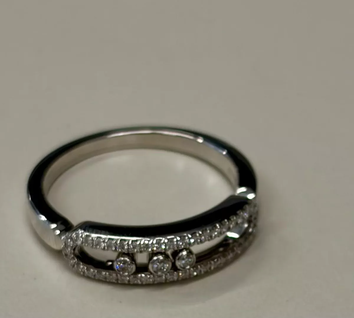 Messika Baby Move Pavé Ring crafted in 18k white gold, featuring three signature moving diamonds