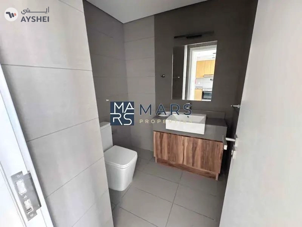 Spacious one bedroom with kitchen appliances in modern community