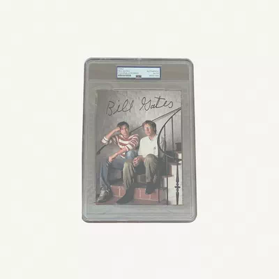 An authentic Bill Gates autographed photographic print featuring Bill Gates and Steve Jobs, certified by PSA/DNA.-0